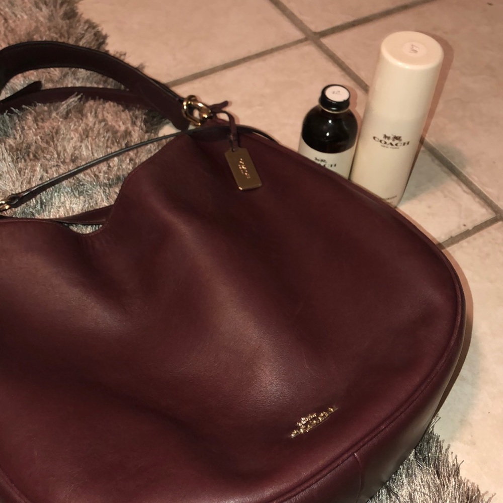 Maroon Coach tote with leather conditioner